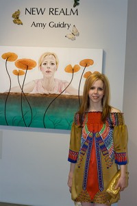 Amy Guidry with her painting, "Introspective"